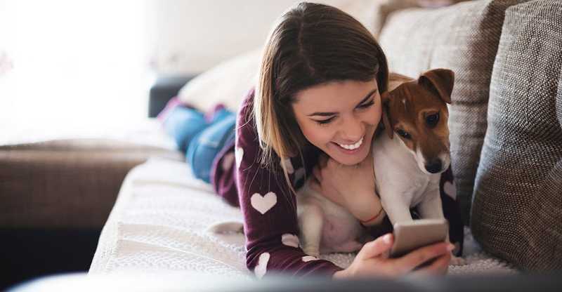 woman and dog on couch